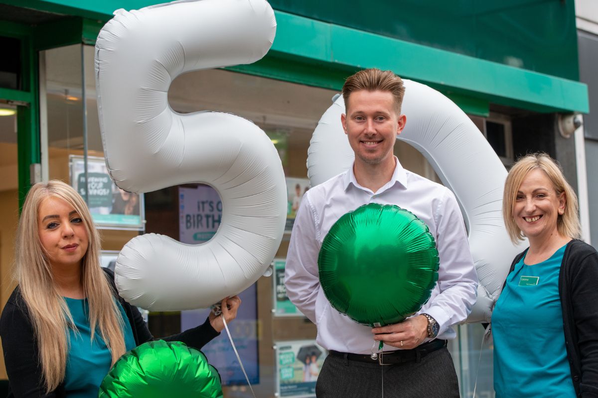 James Cookson (centre) and colleagues celebrating the Preston branch's 50th Birthday in 2023